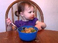 ** Funny baby eating spaghetti **