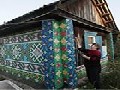 http://www.inspirefusion.com/house_decorated_with_bottle_caps_by_russian_woman/