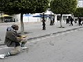 /d4c7503cdb-tunisian-man-holds-back-riot-police-with-a-baguette