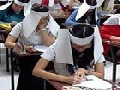 /d7b129f0ee-university-students-forced-to-wear-anti-cheating-blinkers