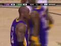 Kobe Bryant punches the ball down