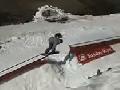 Snowboarder Wipes Out On Rail
